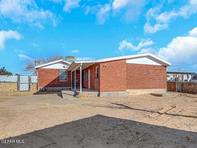 1117 Zuni Pl, El Paso, TX 79925 - view of front of property with a gate and brick siding