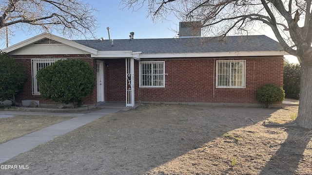 1117 Zuni Pl, El Paso, TX 79925 - single story home with brick siding, a shingled roof, and a chimney