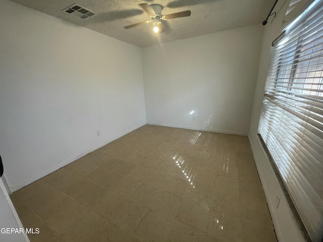 1360 Luz Carpio Way, El Paso, TX 79936 - empty room featuring a ceiling fan, a textured ceiling, and baseboards