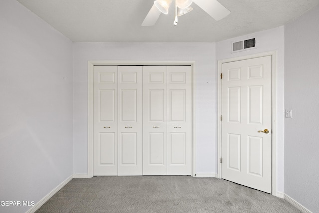 6637 Wind Ridge Dr, El Paso, TX 79912 - unfurnished bedroom with carpet, a closet, and a ceiling fan