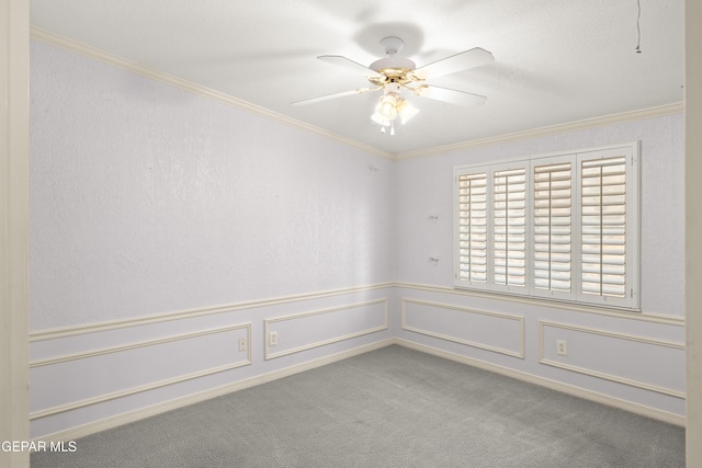 6637 Wind Ridge Dr, El Paso, TX 79912 - carpeted empty room featuring ceiling fan, ornamental molding, and wainscoting
