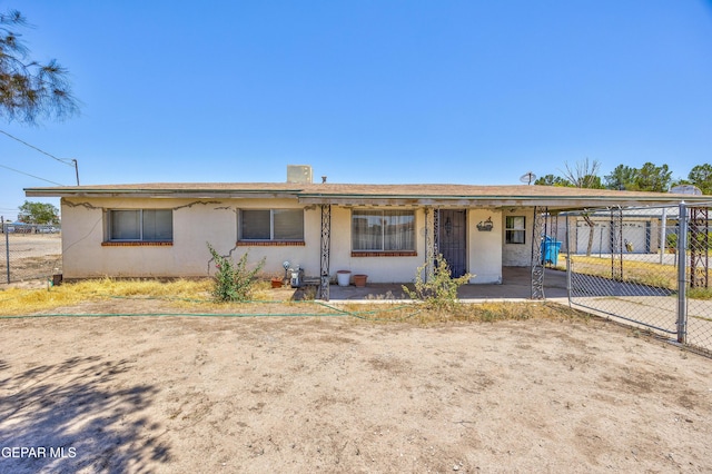 113 N Moon Rd, Socorro, TX 79927 - view of front facade featuring stucco siding and a carport