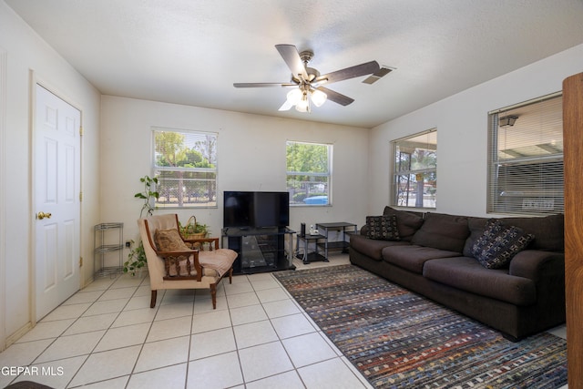 113 N Moon Rd, Socorro, TX 79927 - living room with light tile patterned floors and ceiling fan