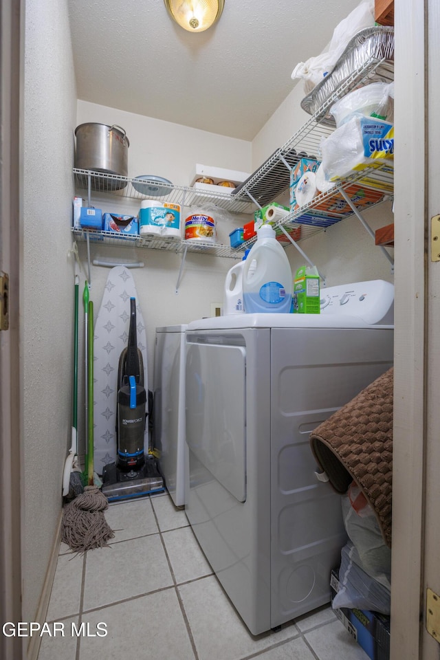 113 N Moon Rd, Socorro, TX 79927 - laundry area with separate washer and dryer and light tile patterned floors