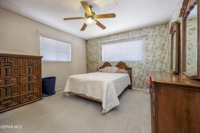 113 N Moon Rd, Socorro, TX 79927 - bedroom featuring light colored carpet, ceiling fan, and wallpapered walls