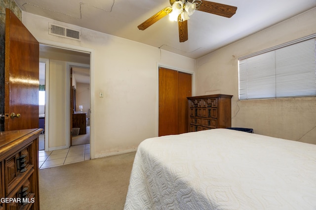 113 N Moon Rd, Socorro, TX 79927 - bedroom with light colored carpet, a closet, and a ceiling fan