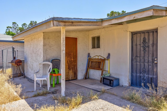 113 N Moon Rd, Socorro, TX 79927 - doorway to property with stucco siding