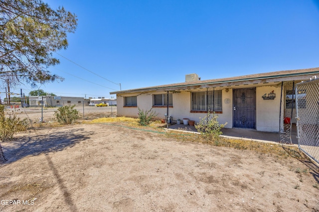 113 N Moon Rd, Socorro, TX 79927 - view of front of property featuring stucco siding and a chimney