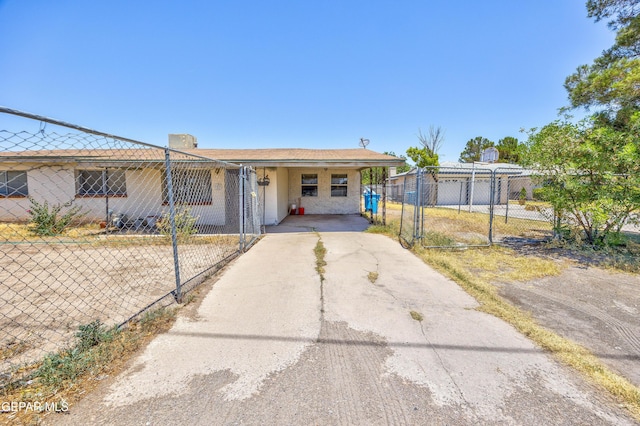 113 N Moon Rd, Socorro, TX 79927 - view of front of property with driveway, an attached carport, and a gate