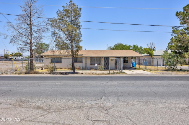 113 N Moon Rd, Socorro, TX 79927 - ranch-style home featuring a fenced front yard, an attached carport, and concrete driveway