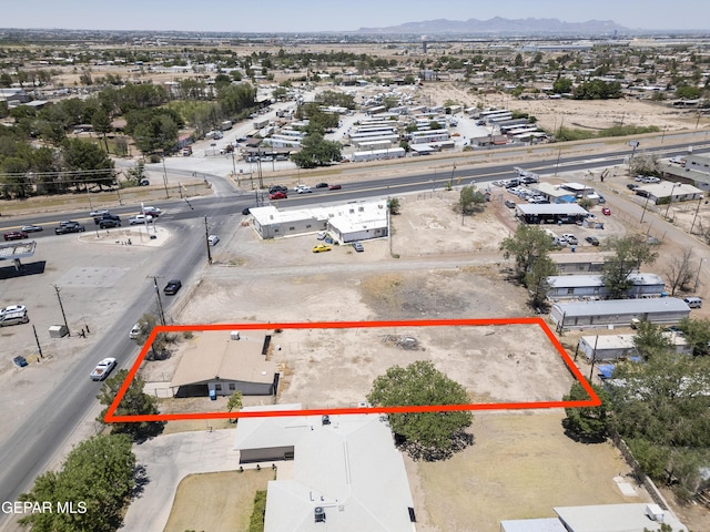 113 N Moon Rd, Socorro, TX 79927 - aerial overview of property's location featuring a mountainous background and property parcel outlined