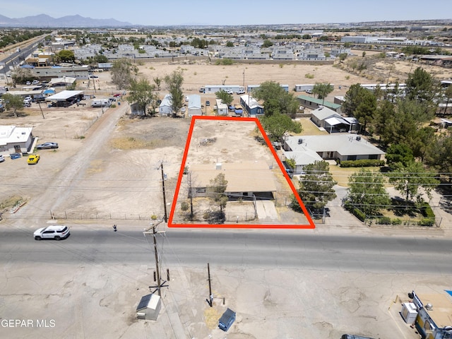 113 N Moon Rd, Socorro, TX 79927 - aerial view of property and surrounding area featuring property parcel outlined and a mountainous background