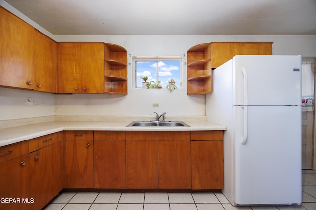 113 N Moon Rd, Socorro, TX 79927 - kitchen with freestanding refrigerator, open shelves, and light countertops