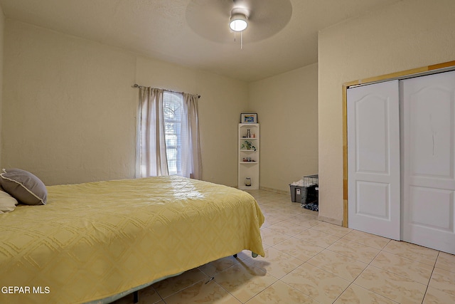6112 Strahan Rd, El Paso, TX 79932 - bedroom featuring light tile patterned floors, a closet, and a ceiling fan