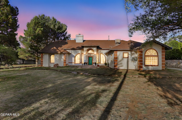 6112 Strahan Rd, El Paso, TX 79932 - view of front of house with stucco siding and a chimney