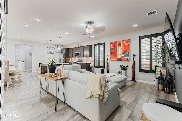 14689 Pebble Hills Blvd, El Paso, TX 79938 - living room featuring recessed lighting, a ceiling fan, and light wood-type flooring