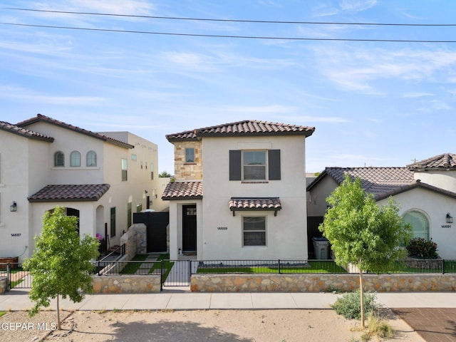 14689 Pebble Hills Blvd, El Paso, TX 79938 - mediterranean / spanish-style house with a tile roof, stucco siding, a fenced front yard, and a gate