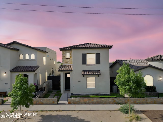 14689 Pebble Hills Blvd, El Paso, TX 79938 - mediterranean / spanish-style house with a tile roof, stucco siding, a fenced front yard, and a gate