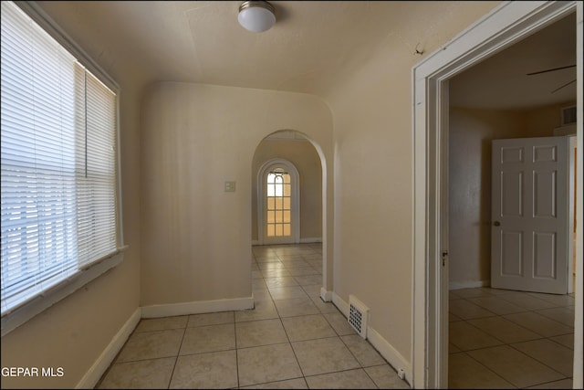 2619 Piedras St Unit A, And B, El Paso, TX 79930 - corridor with arched walkways, light tile patterned floors, and baseboards