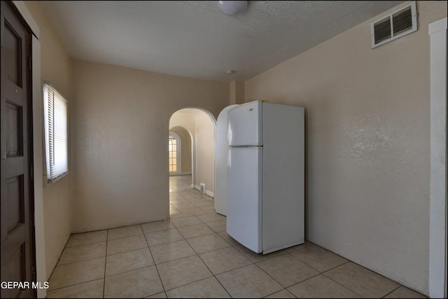 2619 Piedras St Unit A, And B, El Paso, TX 79930 - unfurnished room featuring arched walkways and light tile patterned flooring