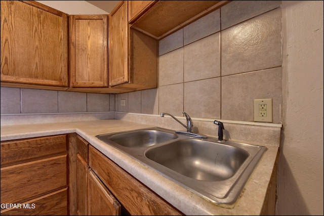 2619 Piedras St Unit A, And B, El Paso, TX 79930 - kitchen featuring a sink, decorative backsplash, brown cabinets, and light countertops