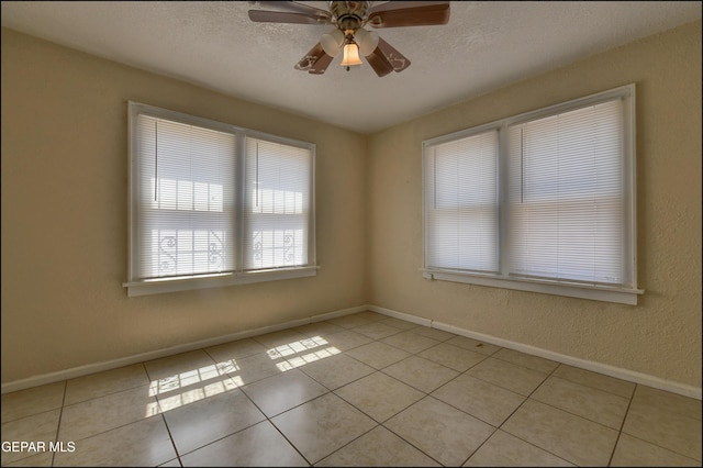 2619 Piedras St Unit A, And B, El Paso, TX 79930 - spare room with a ceiling fan, light tile patterned floors, baseboards, and a textured ceiling