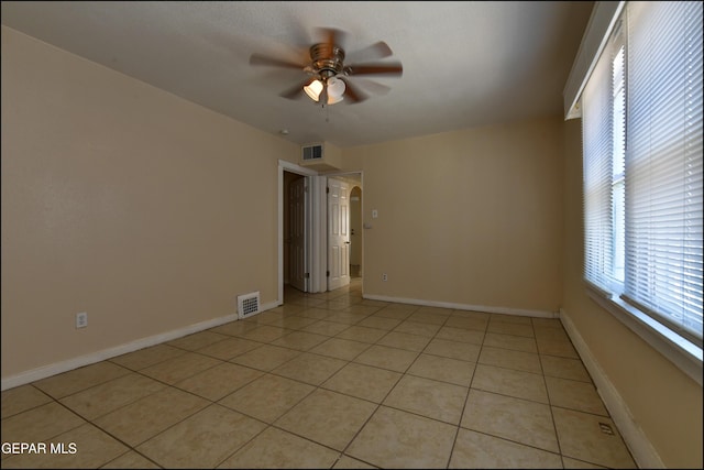 2619 Piedras St Unit A, And B, El Paso, TX 79930 - unfurnished room with a ceiling fan, healthy amount of natural light, light tile patterned flooring, and baseboards