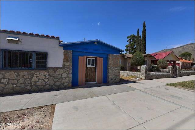 2619 Piedras St Unit A, And B, El Paso, TX 79930 - view of front of property with stone siding and a mountain view