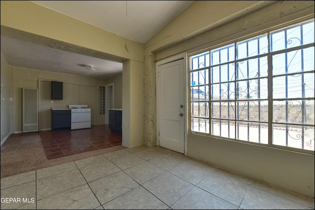 2619 Piedras St Unit A, And B, El Paso, TX 79930 - foyer entrance with healthy amount of natural light, tile patterned flooring, and vaulted ceiling