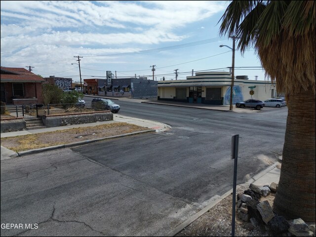 2619 Piedras St Unit A, And B, El Paso, TX 79930 - view of asphalt street featuring street lights, curbs, and sidewalks