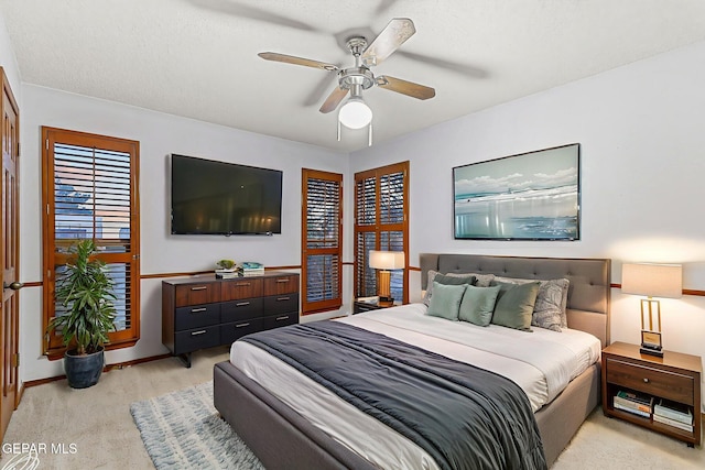 1433 Belvidere St, El Paso, TX 79912 - bedroom with light carpet, baseboards, and a ceiling fan