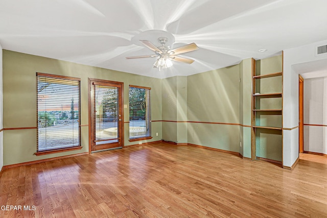 1433 Belvidere St, El Paso, TX 79912 - unfurnished room featuring baseboards, light wood-style flooring, and ceiling fan