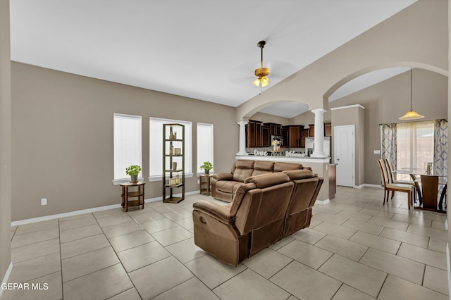 14250 Charles Pollock Ave, El Paso, TX 79938 - living area featuring decorative columns, healthy amount of natural light, arched walkways, a ceiling fan, and lofted ceiling