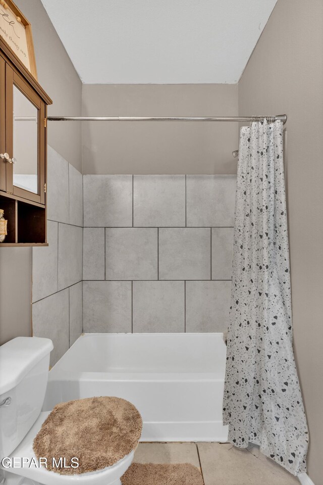 14250 Charles Pollock Ave, El Paso, TX 79938 - bathroom with shower / tub combo, toilet, and tile patterned floors