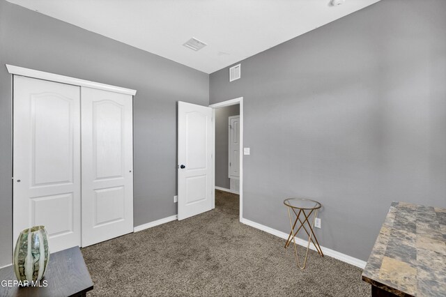 14250 Charles Pollock Ave, El Paso, TX 79938 - unfurnished bedroom with carpet, a closet, and baseboards