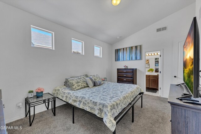 14250 Charles Pollock Ave, El Paso, TX 79938 - bedroom with light carpet, vaulted ceiling, ensuite bathroom, and baseboards