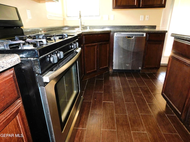 11233 Red Barrel Pl, El Paso, TX 79934 - kitchen featuring appliances with stainless steel finishes, dark wood-style floors, and a sink