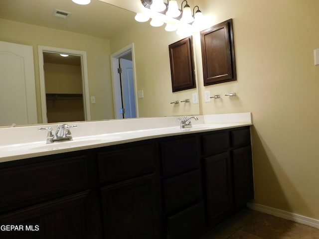 11233 Red Barrel Pl, El Paso, TX 79934 - bathroom featuring double vanity, baseboards, and tile patterned flooring