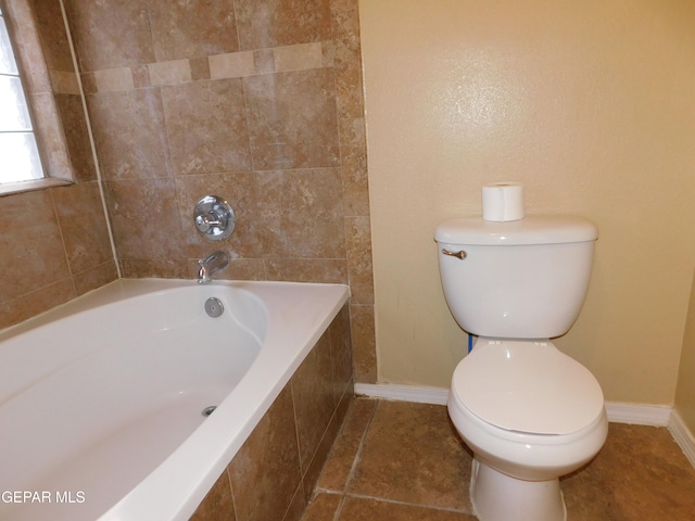 11233 Red Barrel Pl, El Paso, TX 79934 - full bathroom with baseboards, toilet, and tile patterned flooring