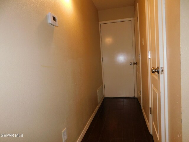 11233 Red Barrel Pl, El Paso, TX 79934 - corridor featuring baseboards and dark wood finished floors
