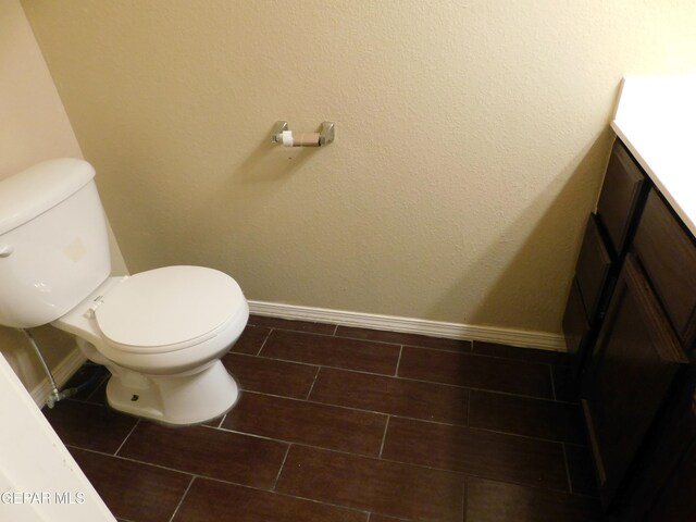 11233 Red Barrel Pl, El Paso, TX 79934 - half bathroom featuring vanity, toilet, and baseboards