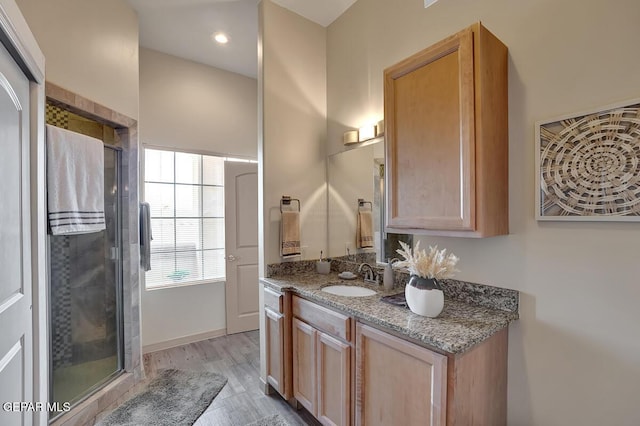 6350 Escondido Dr Unit A24, El Paso, TX 79912 - bathroom featuring a shower stall, vanity, and wood finished floors