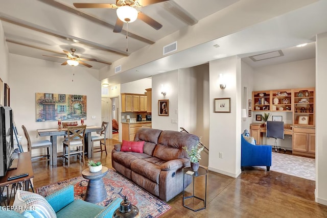6350 Escondido Dr Unit A24, El Paso, TX 79912 - living area featuring a ceiling fan, a desk, concrete flooring, beamed ceiling, and baseboards