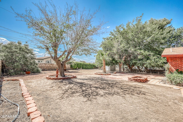 3223 Suffolk Rd, El Paso, TX 79925 - view of yard with a fire pit