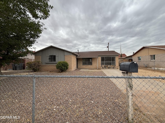 5808 Dearborne Dr, El Paso, TX 79924 - view of front of property featuring board and batten siding, brick siding, and oil tank