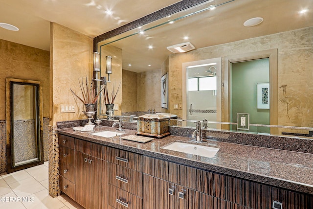 5744 Mira Grande Dr, El Paso, TX 79912 - bathroom with double vanity and tile patterned floors