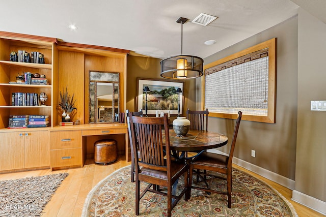 5744 Mira Grande Dr, El Paso, TX 79912 - dining space featuring light wood-style floors and baseboards