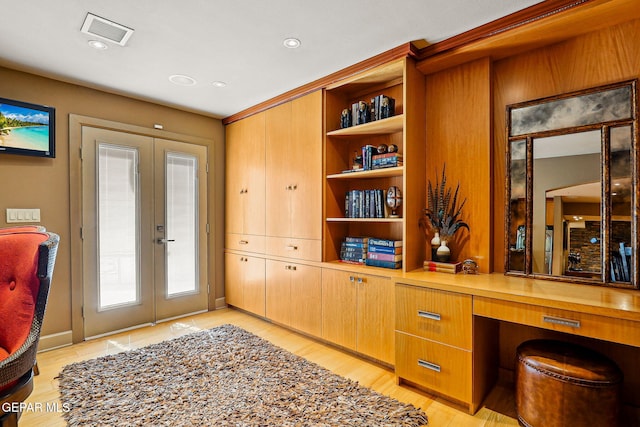 5744 Mira Grande Dr, El Paso, TX 79912 - office space featuring french doors, built in study area, and light wood-style floors