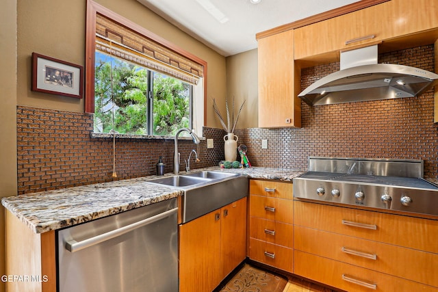 5744 Mira Grande Dr, El Paso, TX 79912 - kitchen featuring appliances with stainless steel finishes, wall chimney exhaust hood, a sink, and light stone counters