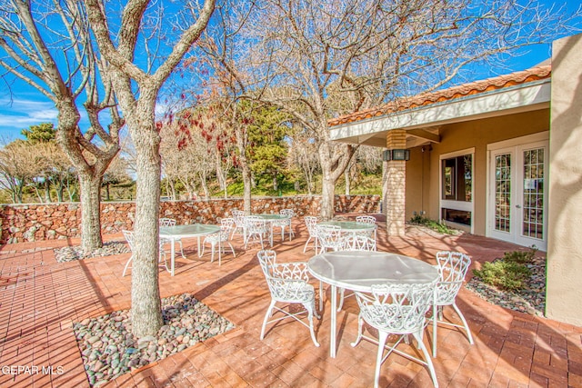 5744 Mira Grande Dr, El Paso, TX 79912 - deck featuring outdoor dining space, a patio area, and french doors